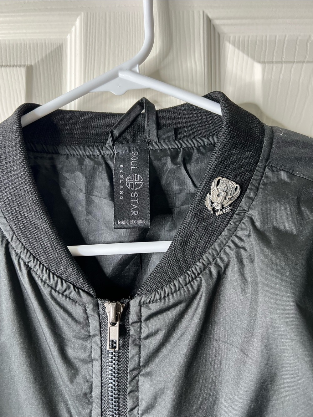 Black Bomber Jacket with Crest Pin